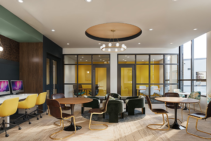 a study lounge with private study tables and computers