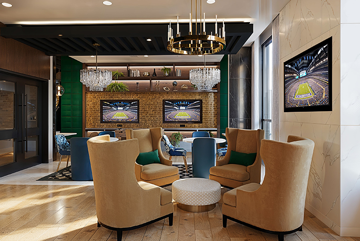 resident clubroom with large TV screens and lounge seating